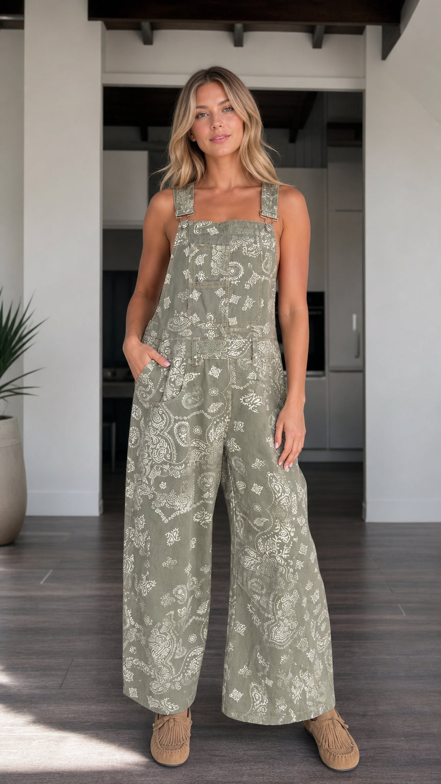 Front view of woman wearing Sage Green paisley print wide-leg bib overalls
