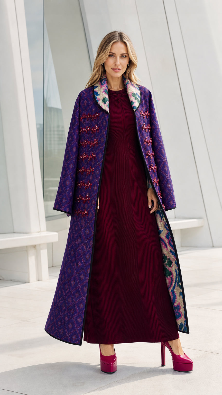 Front view of model wearing the purple quilted long coat