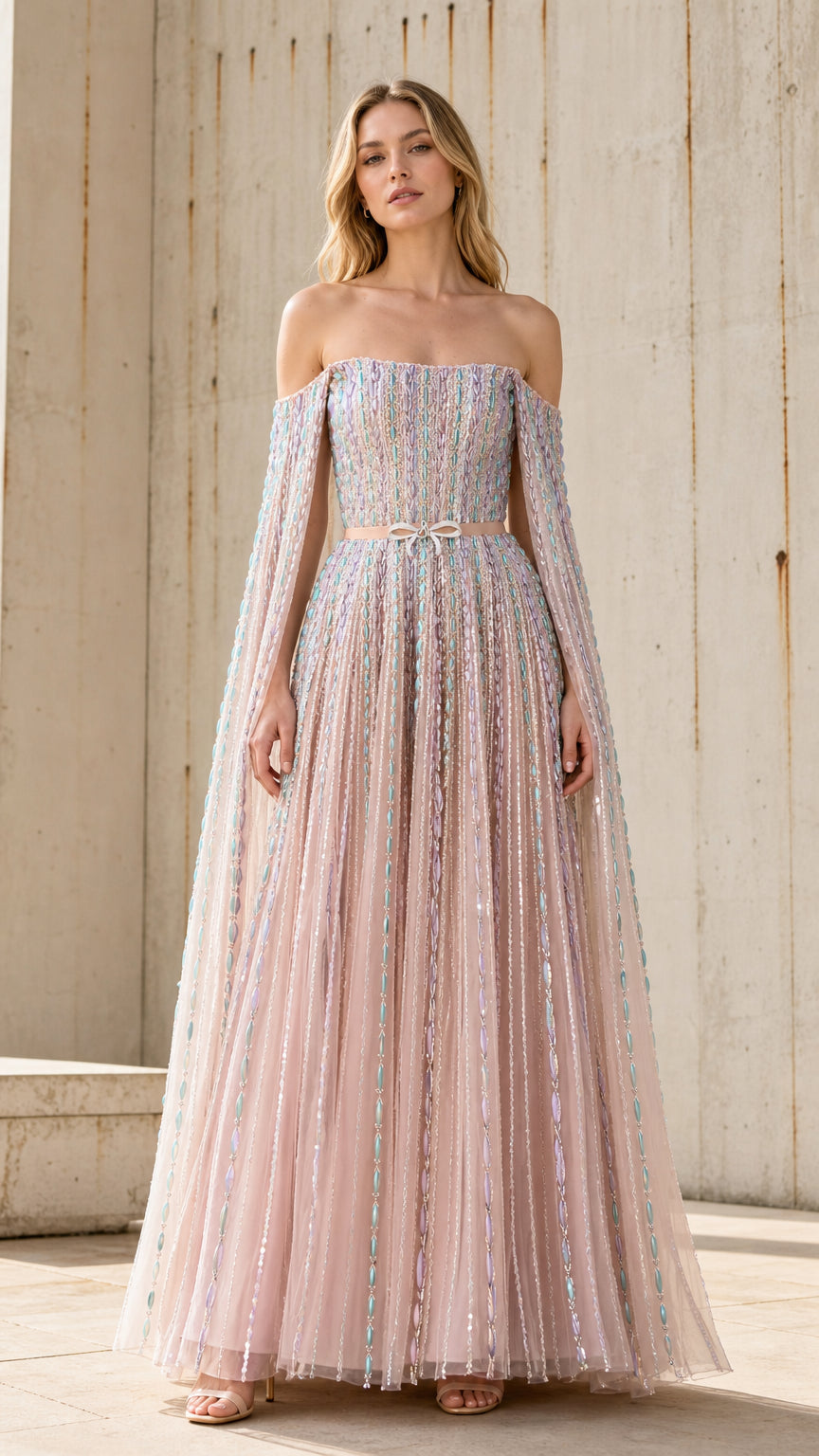 Front view of pink off-the-shoulder tulle evening gown with cape sleeves