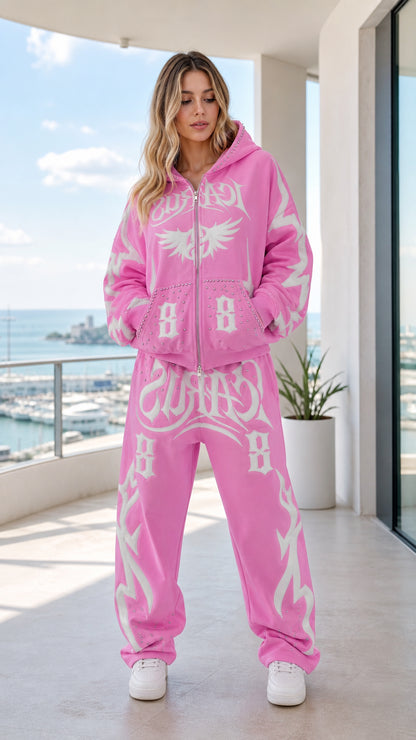 Front view of model wearing pink Y2K graphic zip-up hoodie and sweatpants set
