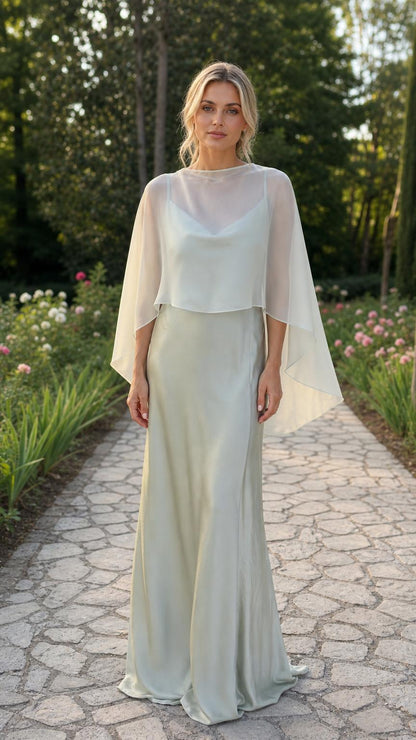 Front view of model wearing sage green capelet evening dress