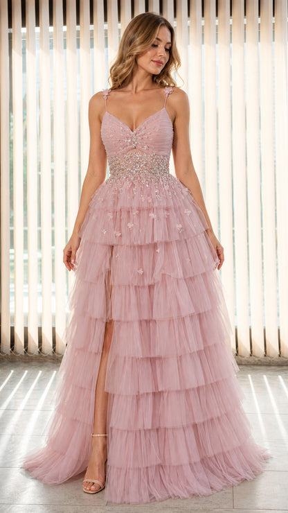 Model wearing Dusty Pink tiered tulle evening gown with beaded waist and high slit front view