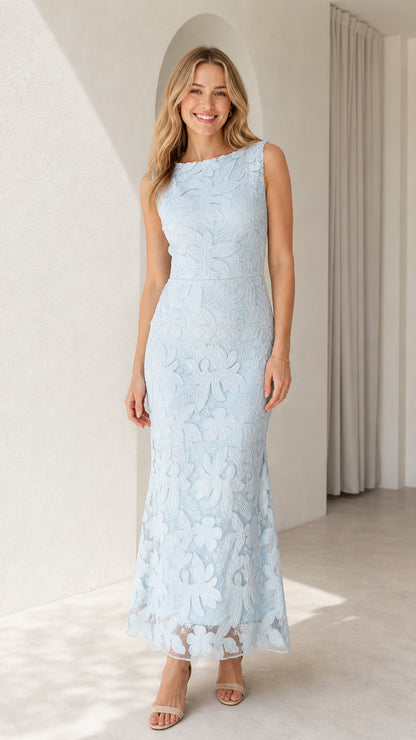 Model wearing light blue sleeveless floral lace boatneck maxi dress front view