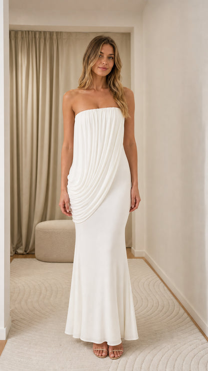 Model wearing white strapless draped maxi dress, front view