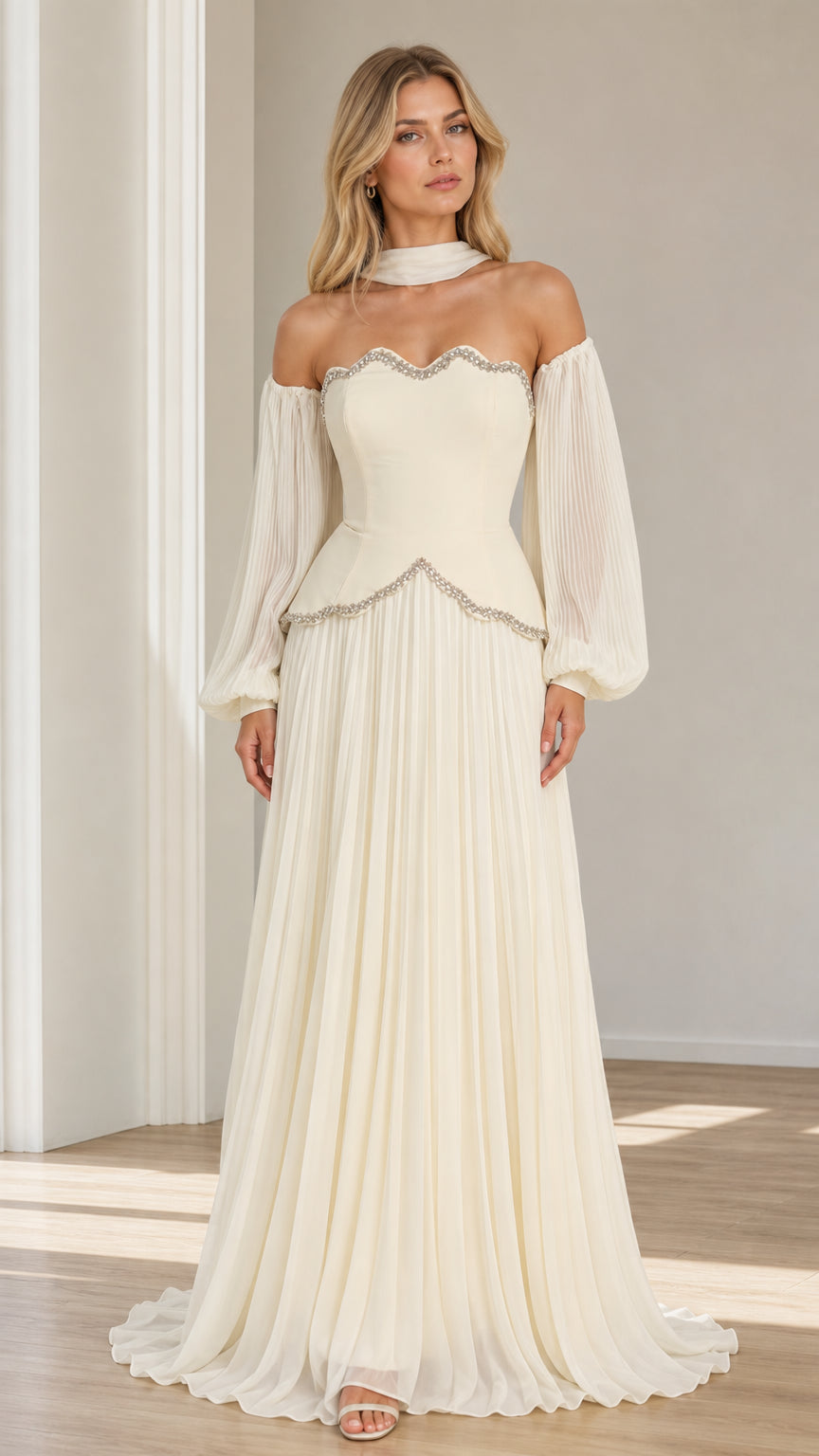 Front view of model wearing ivory off-the-shoulder pleated maxi evening gown with beaded scallop trim and choker