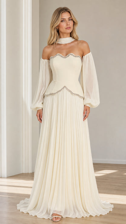 Front view of model wearing ivory off-the-shoulder pleated maxi evening gown with beaded scallop trim and choker