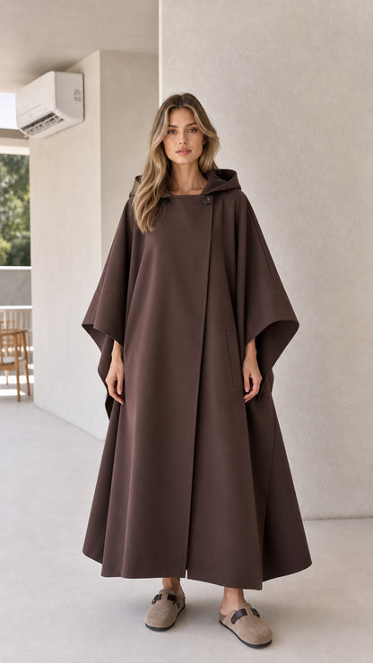 Full front view of model wearing brown hooded maxi cape coat