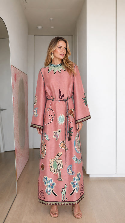 Model wearing pink boho printed long sleeve maxi dress, front view