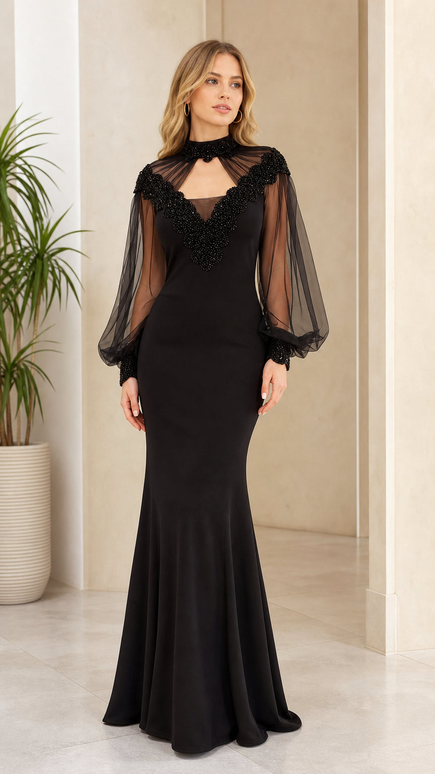 Front view of black beaded mesh evening gown