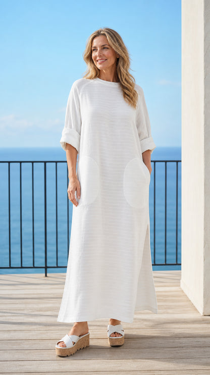 Woman wearing white long sleeve maxi dress front view