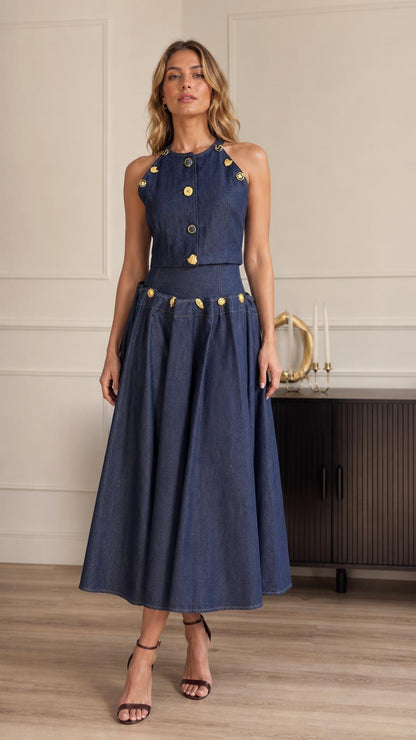 Front view of model wearing blue denim halter top and midi skirt set