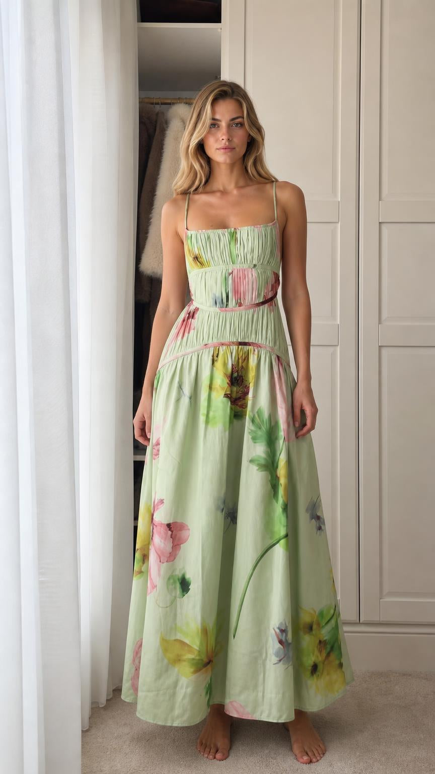 Model wearing green floral print smocked maxi dress front view
