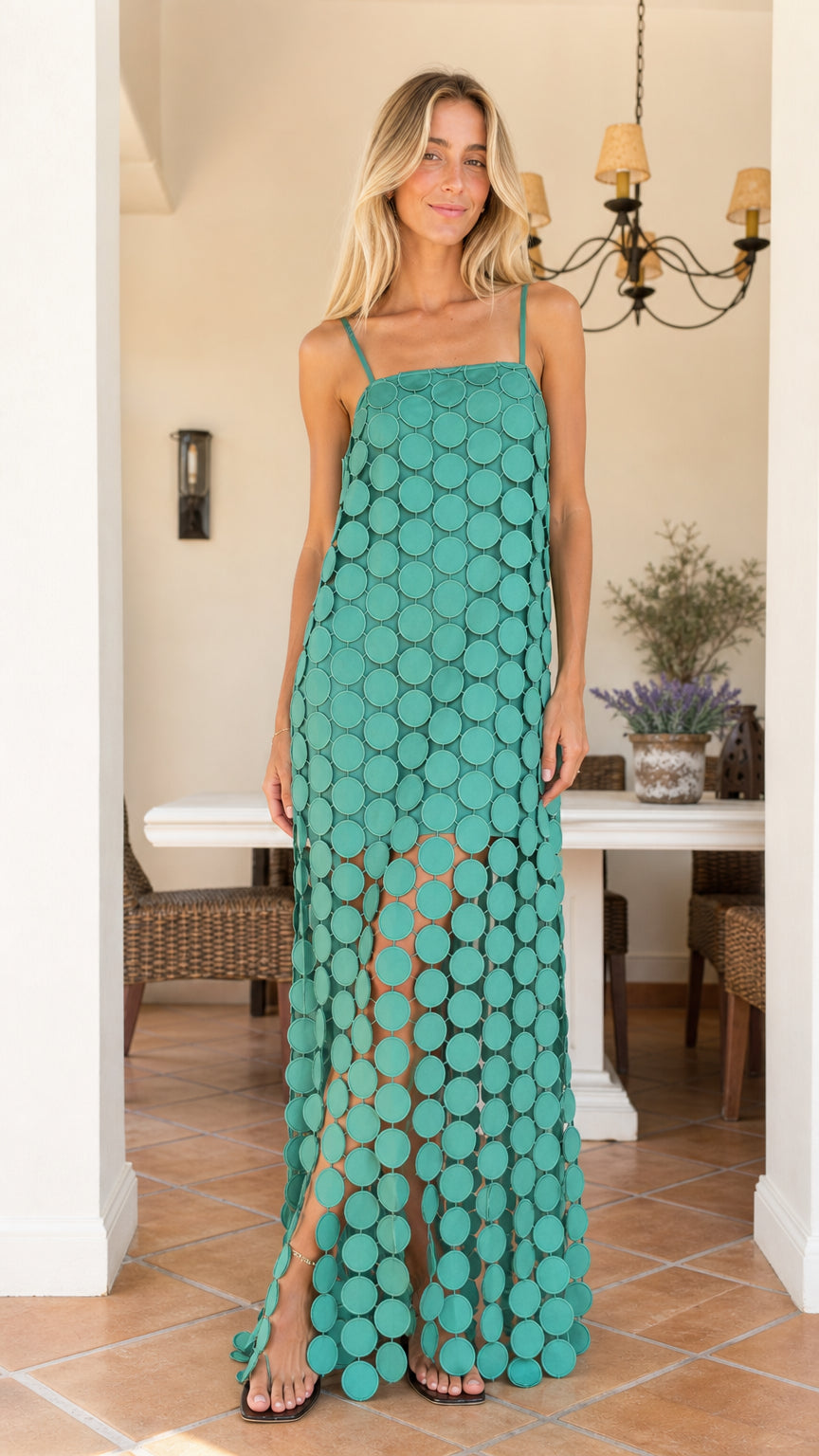 Front view of woman wearing teal cutout circle maxi dress