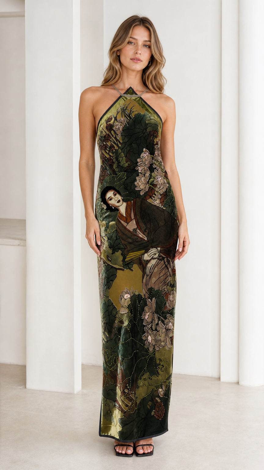 Model wearing olive green velvet halter maxi dress, front view