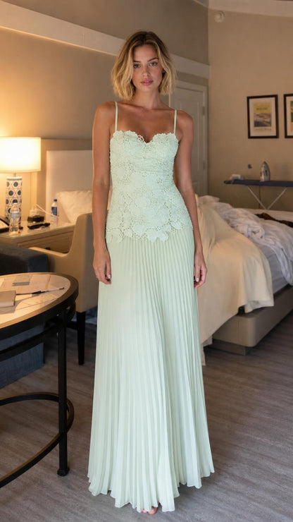 Front view of model wearing mint lace pleated maxi dress