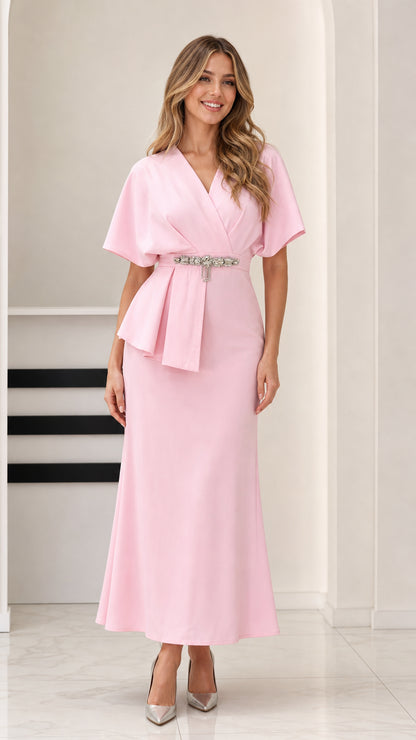 Full front view of model wearing Light Pink flutter sleeve peplum maxi dress with crystal waist detail