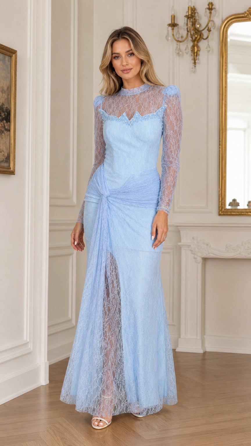 Full front view of a woman wearing a light blue long sleeve lace evening gown with mock neckline and twist waist