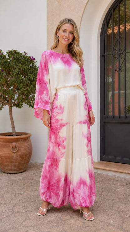 Model wearing pink tie-dye long sleeve blouse and wide leg pants set front view