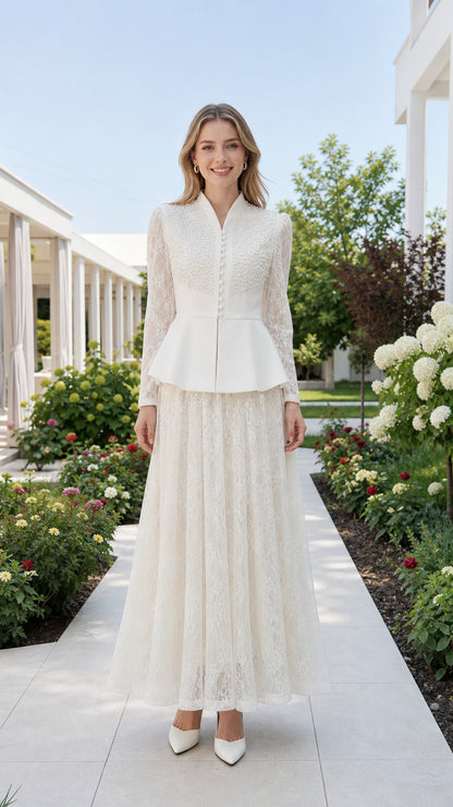 Front view of white pearl-embellished peplum top and lace maxi skirt set
