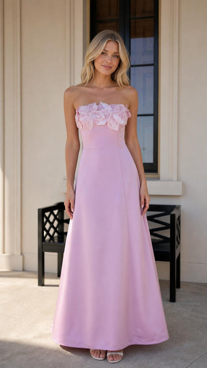 Front view of model wearing pink strapless 3D floral maxi dress