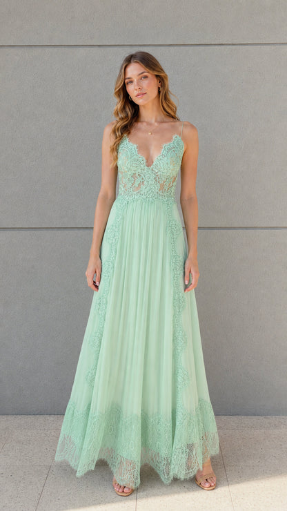 Front full view of woman wearing mint green floral lace pleated maxi dress