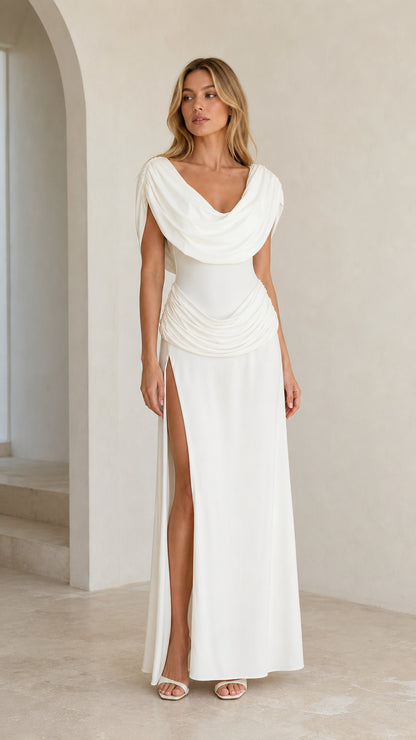 Front view of model wearing White cowl neck maxi dress with high slit