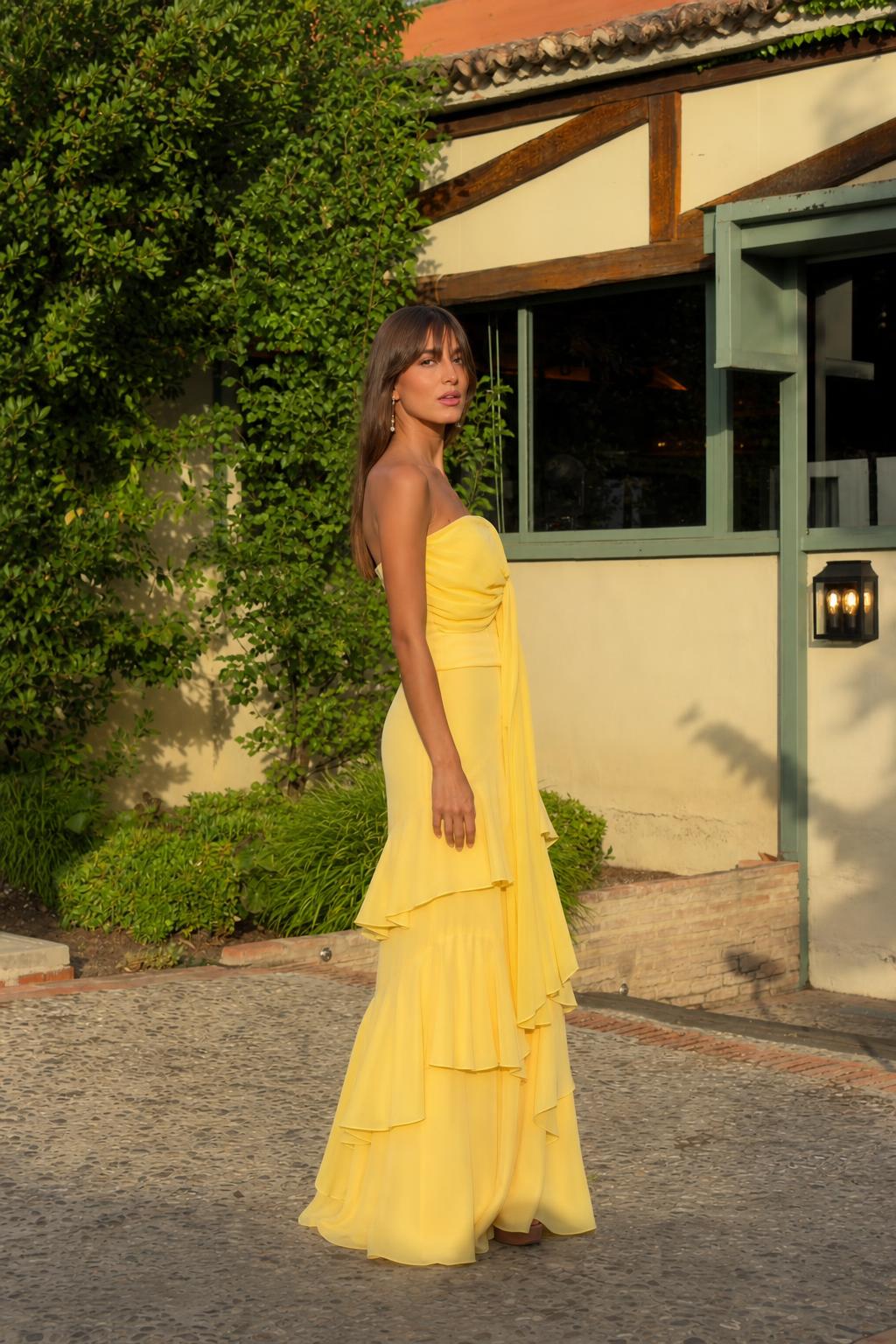 Side profile view of yellow evening gown