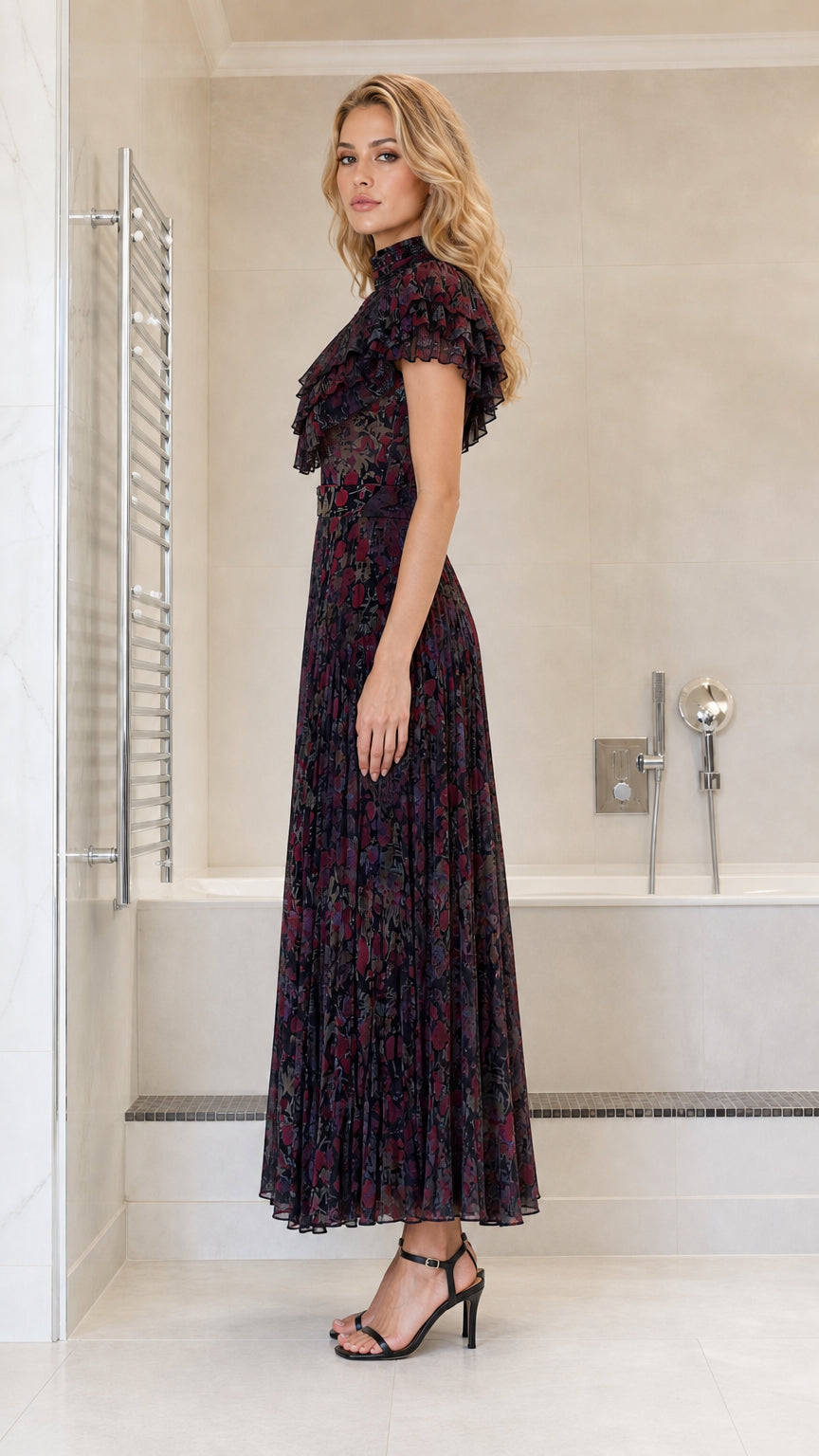 Side profile view of dark multi pleated maxi dress