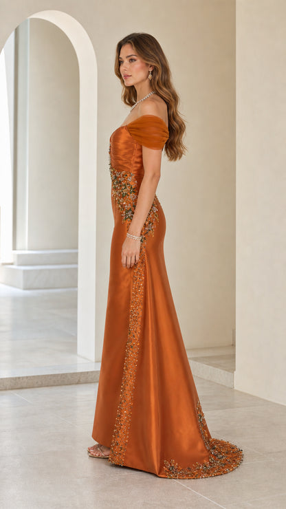 Side profile view of rust orange satin evening gown with sweep train