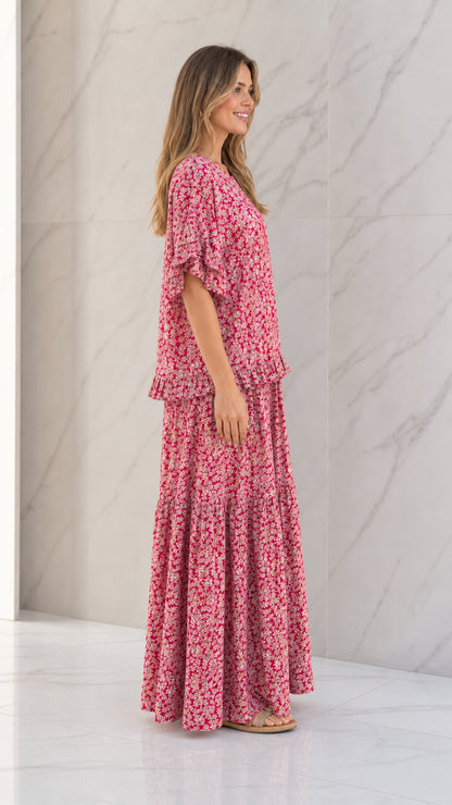 Side full view of woman wearing Rose Pink floral matching two-piece set