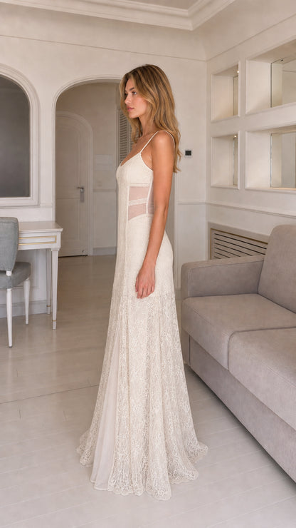 Side profile view of ivory lace slip dress showing sheer side panel