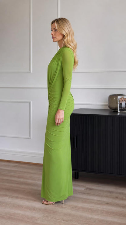 Model wearing green ruched long-sleeve maxi dress side profile view