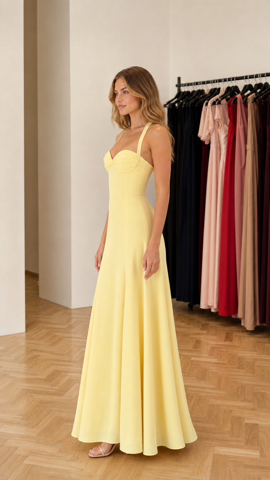 Side profile of model in yellow formal gown