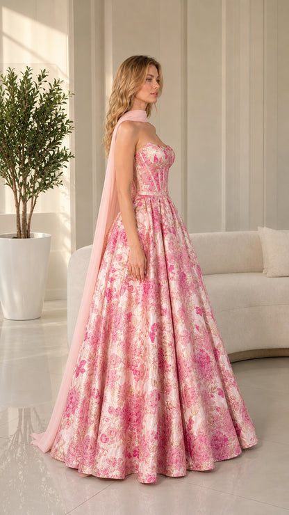 Side profile view of pink floral brocade gown