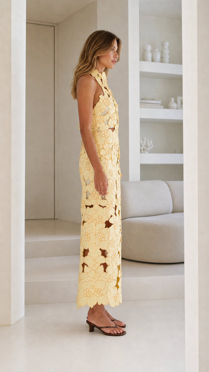 Side view of Yellow floral laser-cut midi dress