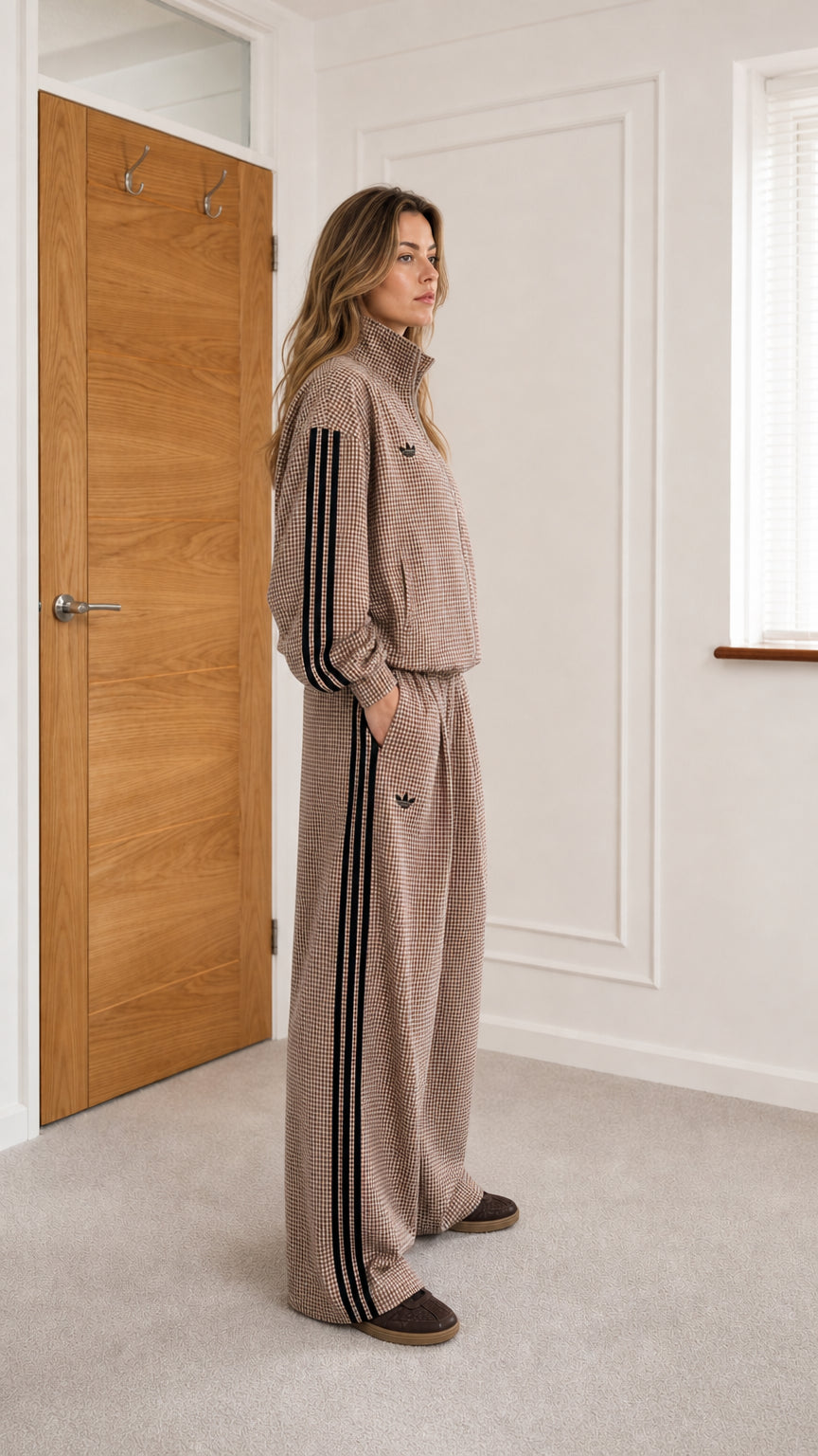 Side profile view of model wearing camel houndstooth track set