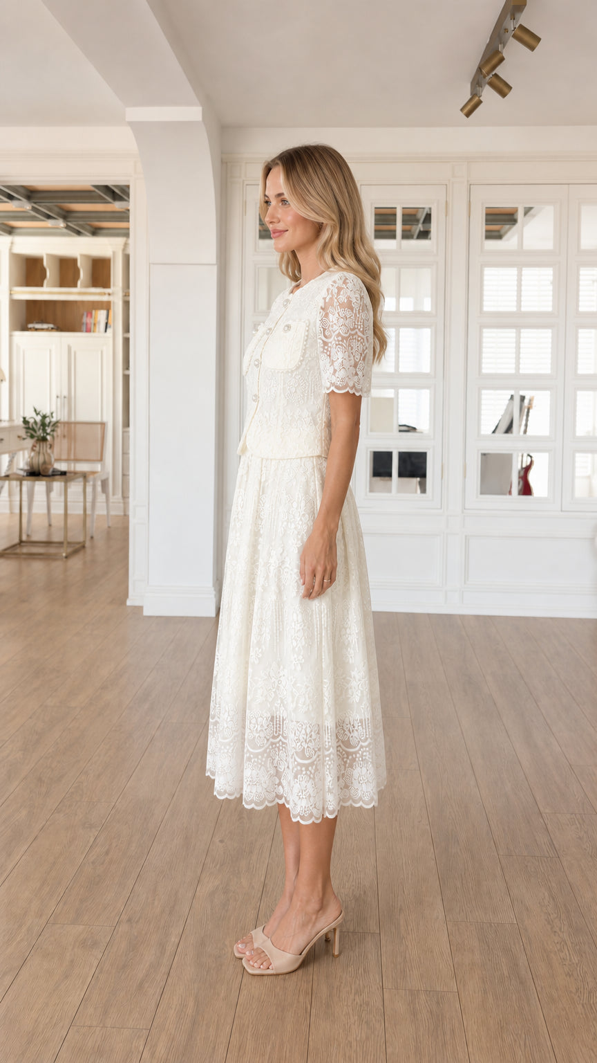 Side profile view of white lace dress set