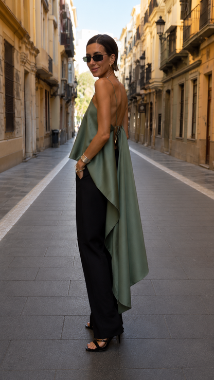 Side view of sage green draped cami top with long cascading hem