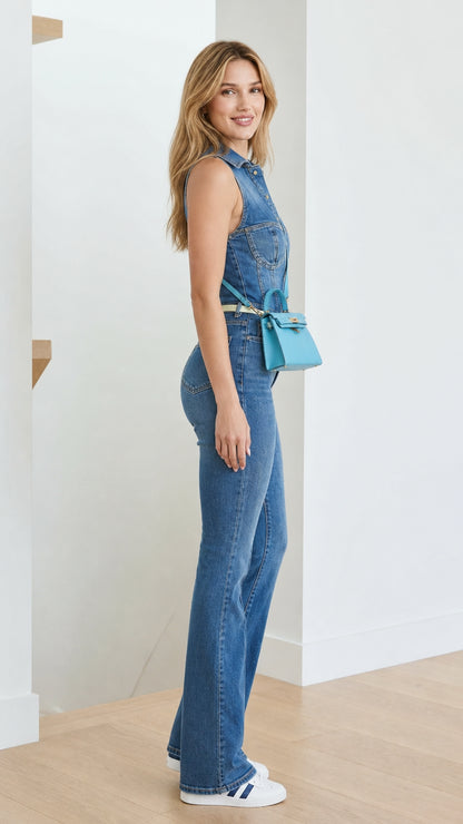 Side view of model wearing blue denim flare jumpsuit