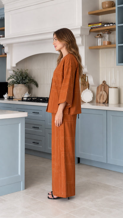 Side profile view of model wearing Rust linen-look matching set