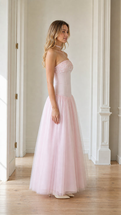 Side profile view of the pink tulle maxi gown