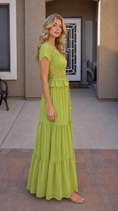 Side profile view of green maxi dress