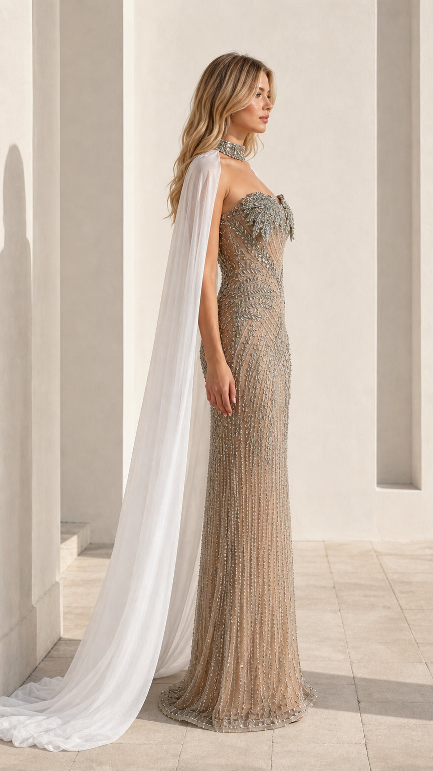 Side profile of model in champagne embellished gown