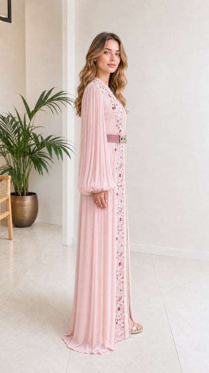 Side profile view of blush pink pleated kaftan dress with balloon sleeves