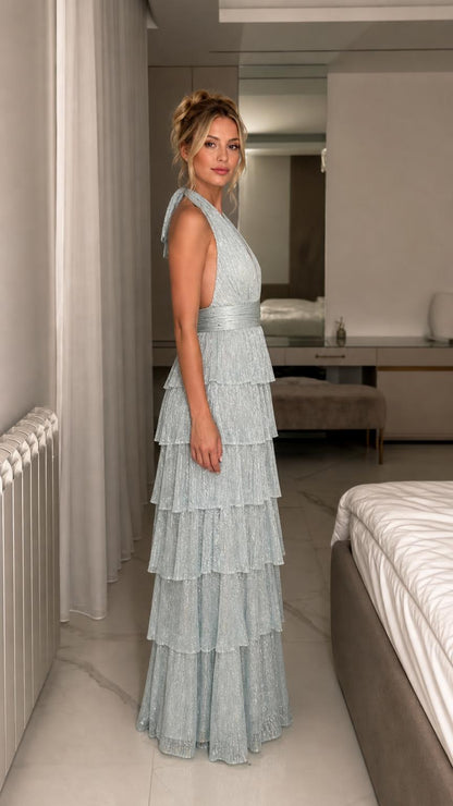 Side profile view of light blue tiered evening dress
