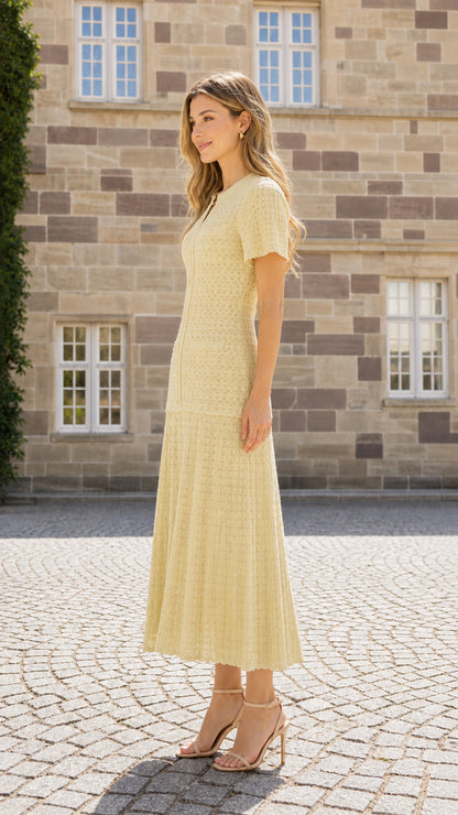 Side view of model wearing yellow textured knit midi dress