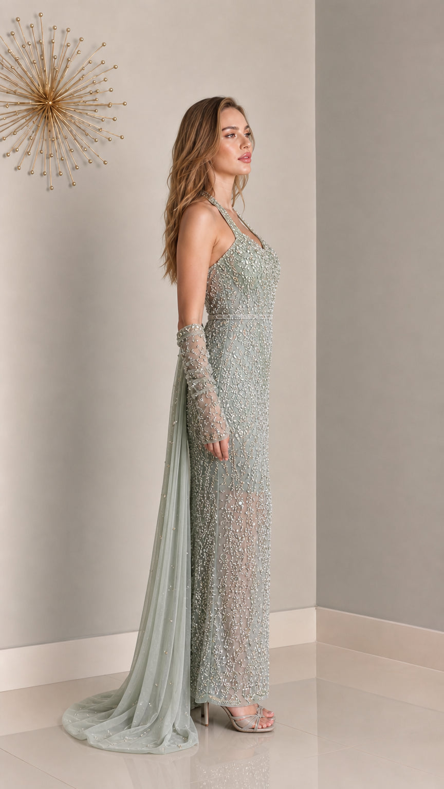 Side profile of sage green formal gown with sheer train