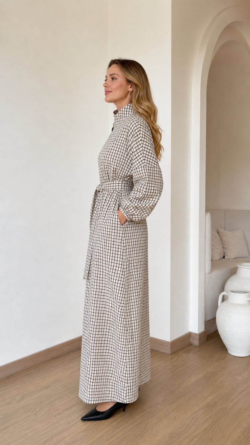 Side profile view of woman wearing Cream check long sleeve maxi dress