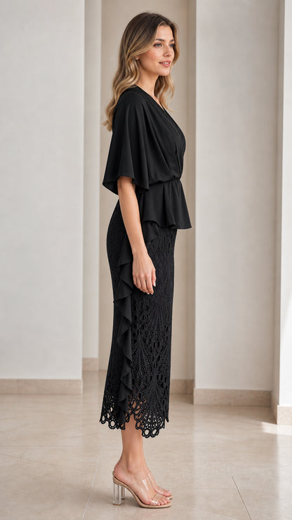 Side full-length view of black lace midi dress with cascading ruffle