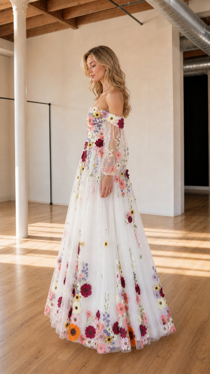 Side three-quarter view of ivory floral embroidered tulle evening gown